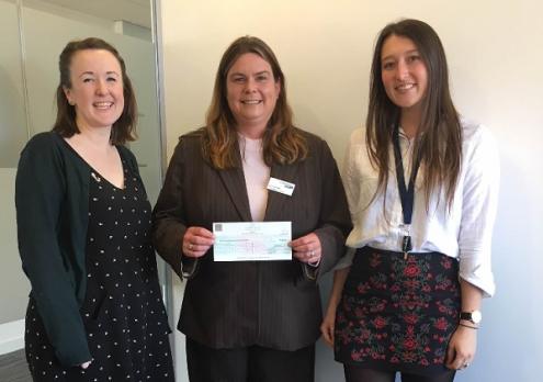 Chiara and her colleagues presenting a cheque to Lymphoma Action’s Lucie Howells. 