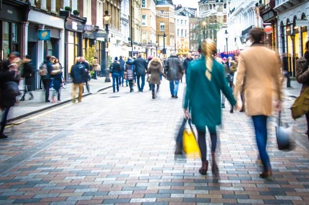 people walking down a high street