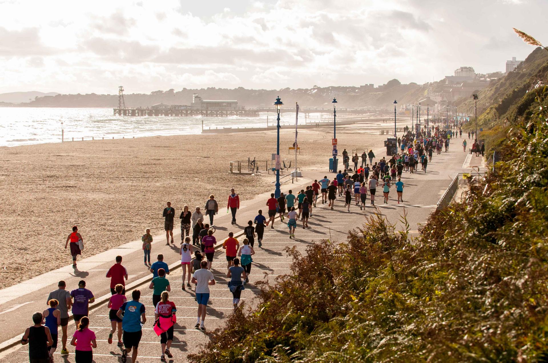 Hundreds of runners alongside Bournemouth Coastline