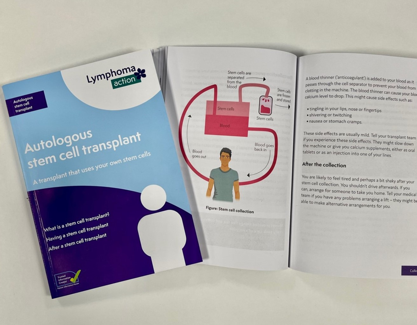 Two Autologous stem cell transplant books - one open on a page with a diagram explaining the process of stem cell collection, and the other book is showing the light blue front cover