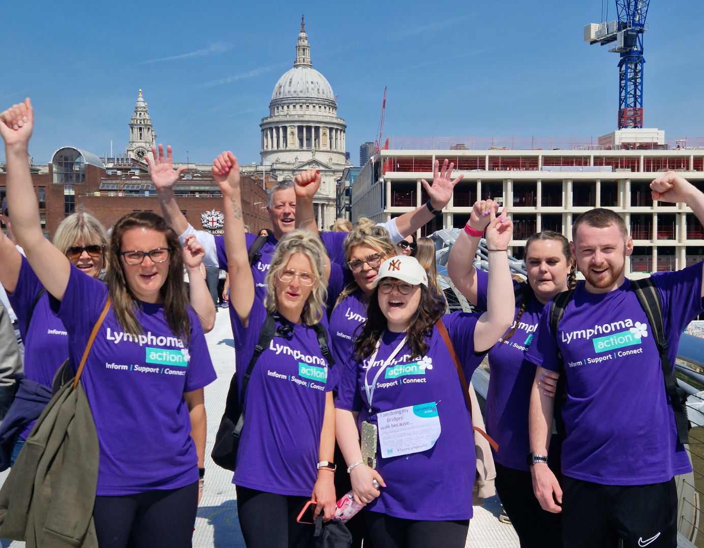 Group of people wearing Lymphoma Action T-shirts with St Paul's Cathedral in background