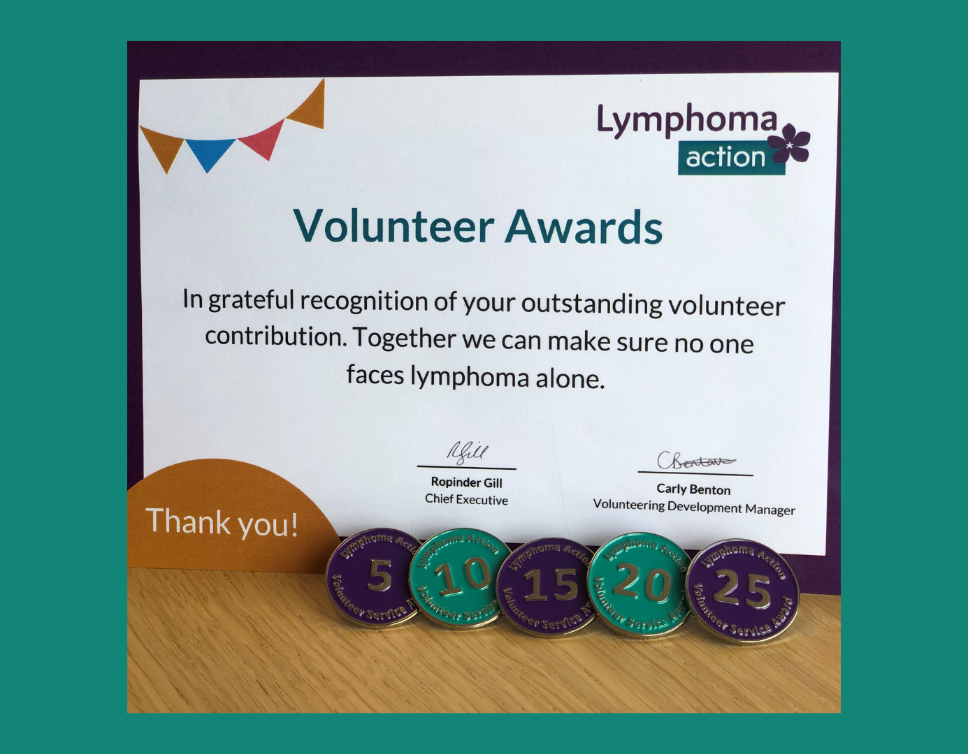 Image of Lymphoma Action Volunteer Awards certificate and badges
