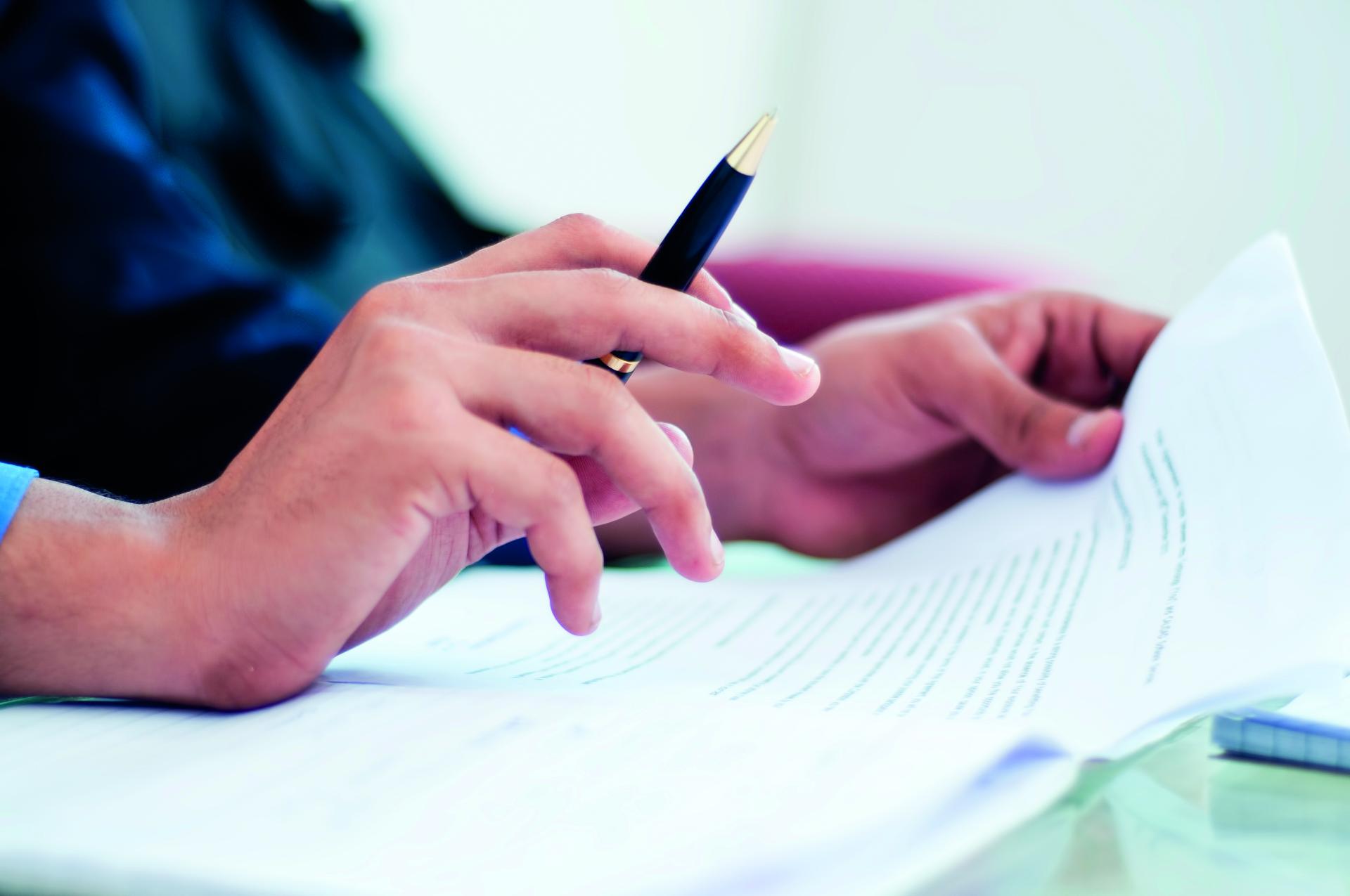 A person signing a document