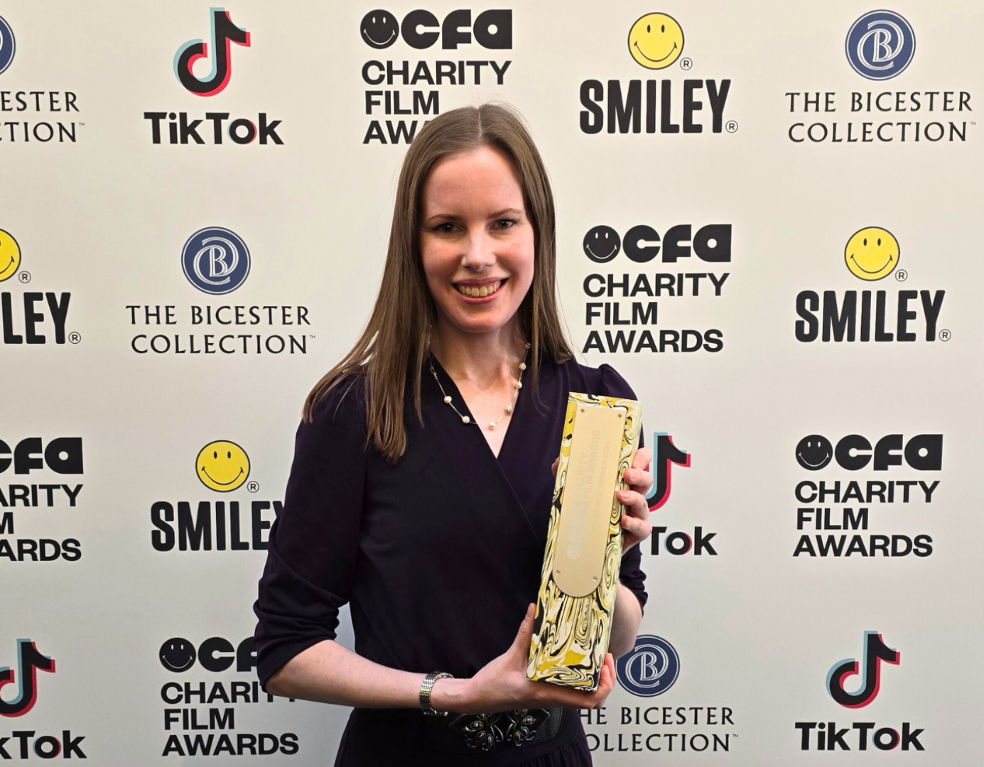 Deborah holding our Smiley Film Award