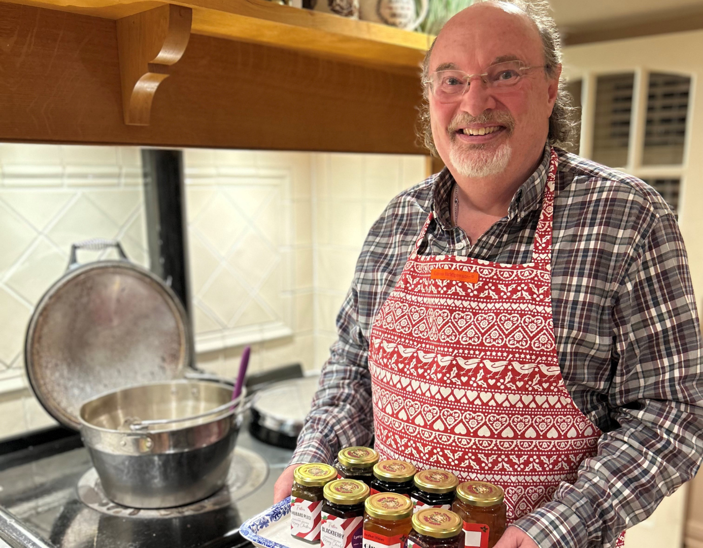 Alister holding home made jams and preserves