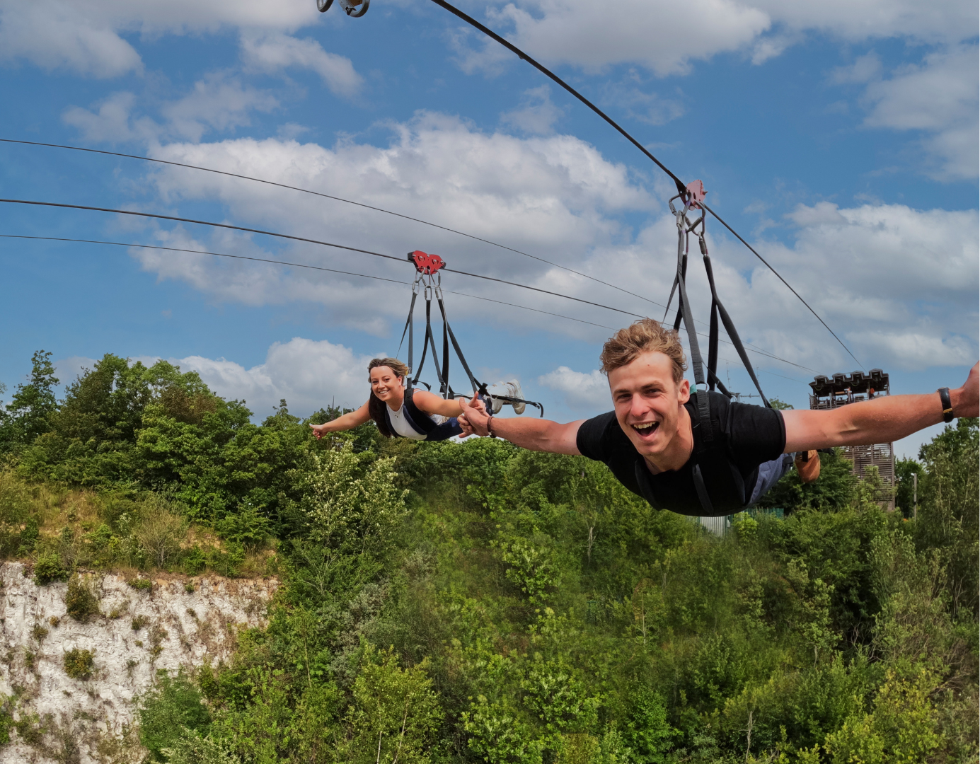 Young man and woman on a zipline