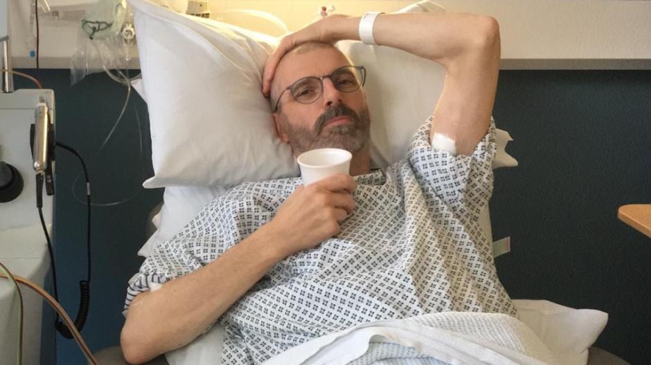 Man in hospital bed having treatment for lymphoma