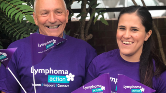 Two Lymphoma Action volunteers waving flags