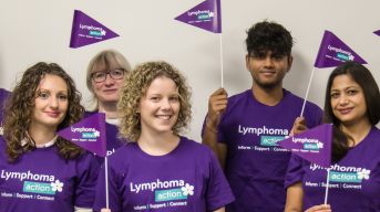 Lymphoma Action volunteers waving flags