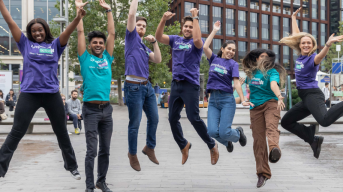 Employees leaping with joy