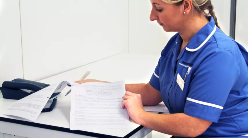 Nurse holding paper