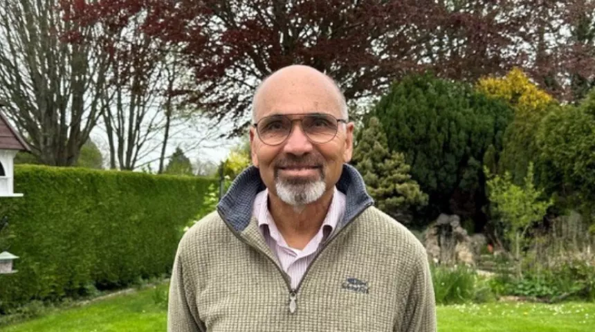 A picture of Jeff, our volunteer, smiling in his garden