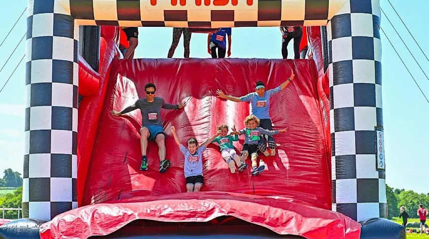 Family sliding down inflatable 