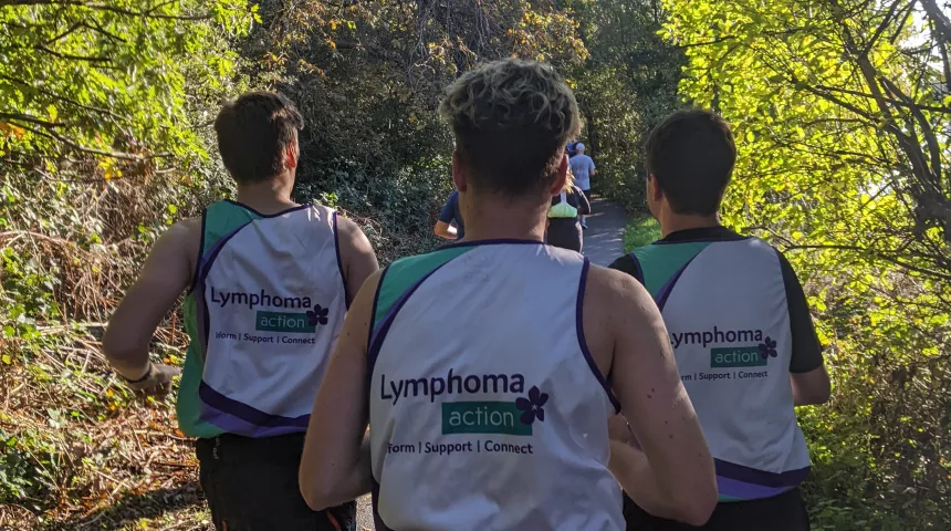 3 Lymphoma Action runners, running through woodland 