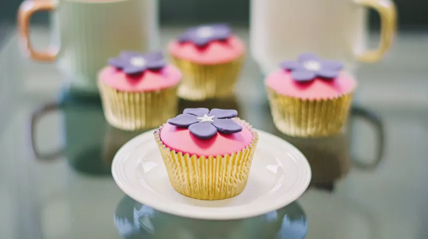 Cupcakes decorated with purple periwinkles