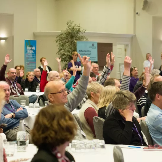 National.Conference.Crowd.Raising.Hands