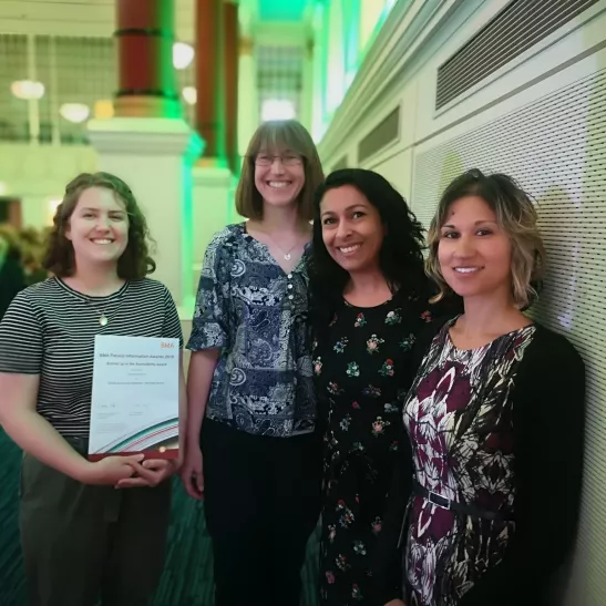 Publications Team with one of their awards