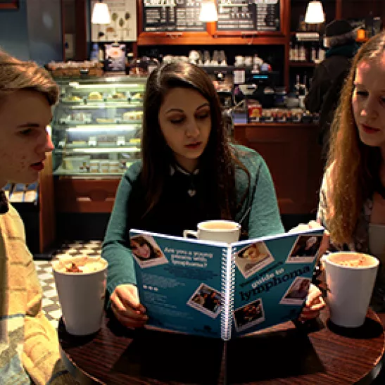 Three young people reading Young person's guide to lymphoma