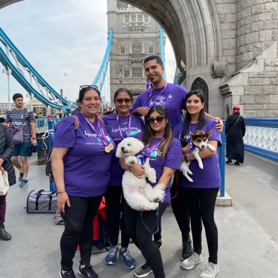 Meha in London with two sisters, mum, husband and family dog
