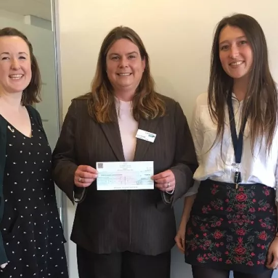 Chiara and her colleagues presenting a cheque to Lymphoma Action’s Lucie Howells. 