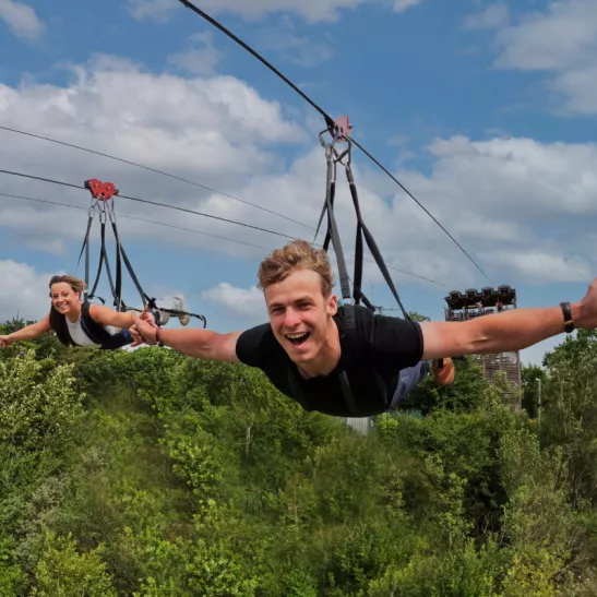 Man and woman on a zipline