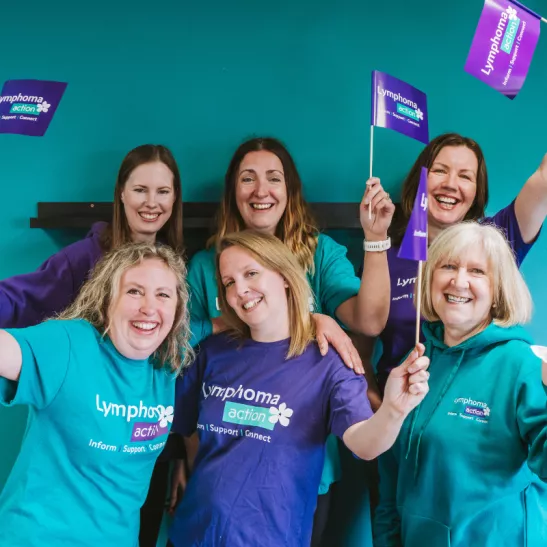 Lymphoma Action staff waving flags