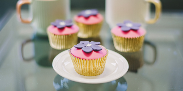 Cupcakes decorated with purple periwinkles