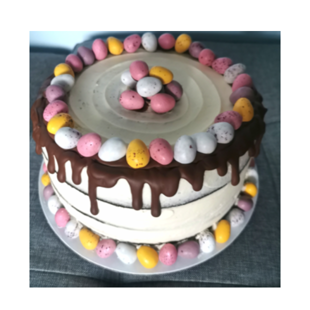 Cake decorated with chocolate and mini eggs
