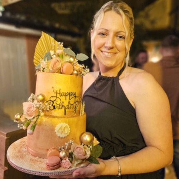Woman holding birthday cake