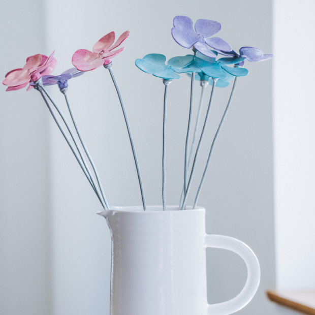 Periwinkle sculptures in a jug